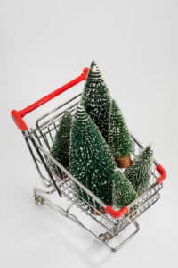 Miniature Christmas trees in the shopping cart, from above, white background, icon image, Christmas shopping, Miniature Christmas trees in the shopping cart, from above, white background, icon image, Christmas shopping,